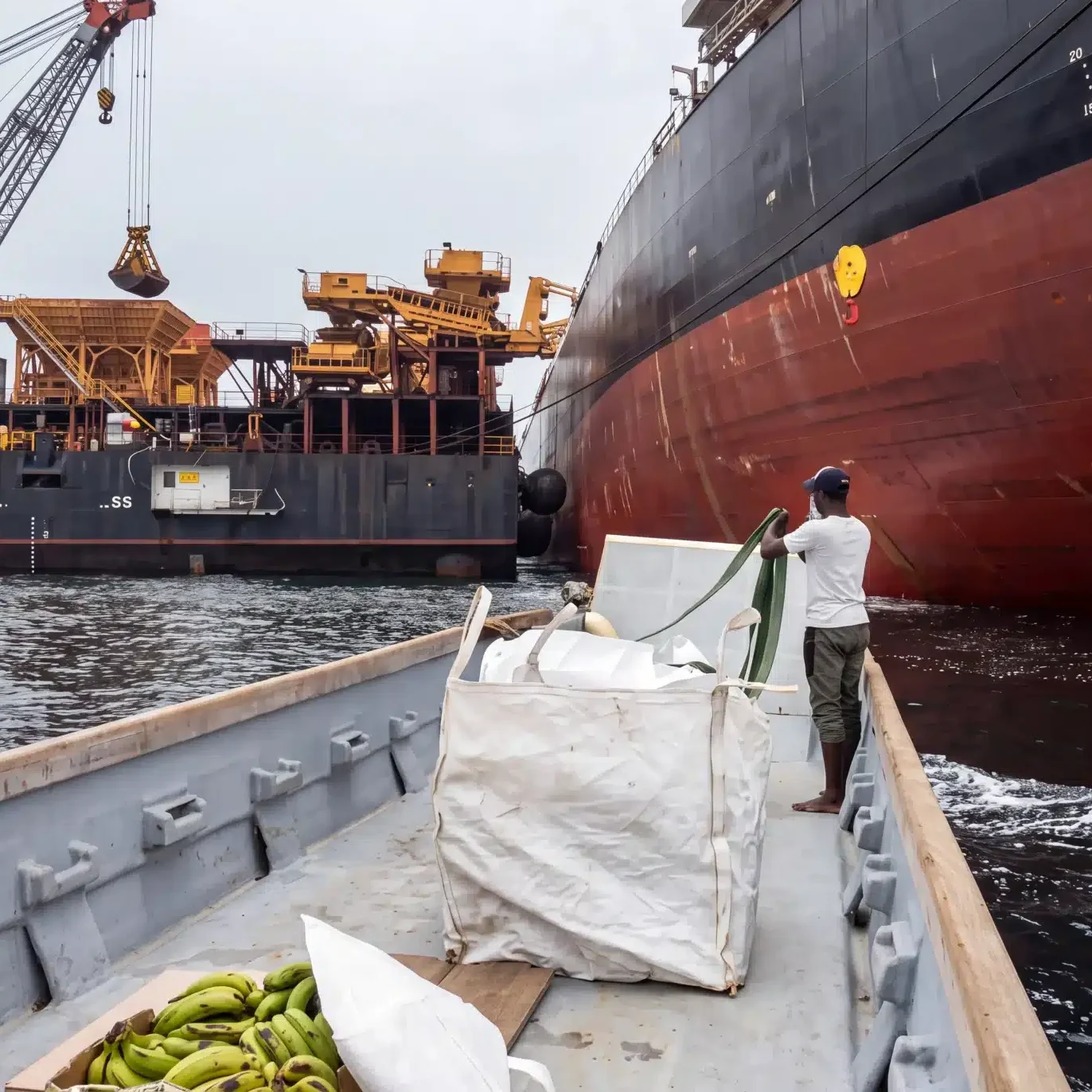 Chamax Marine Services boat delivering provisions to a vessel at anchorage in Gabon
